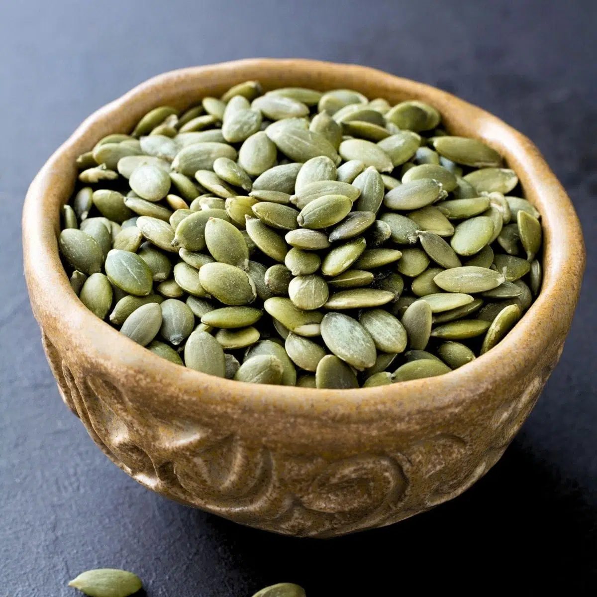 ceramic bowl full of pepitas