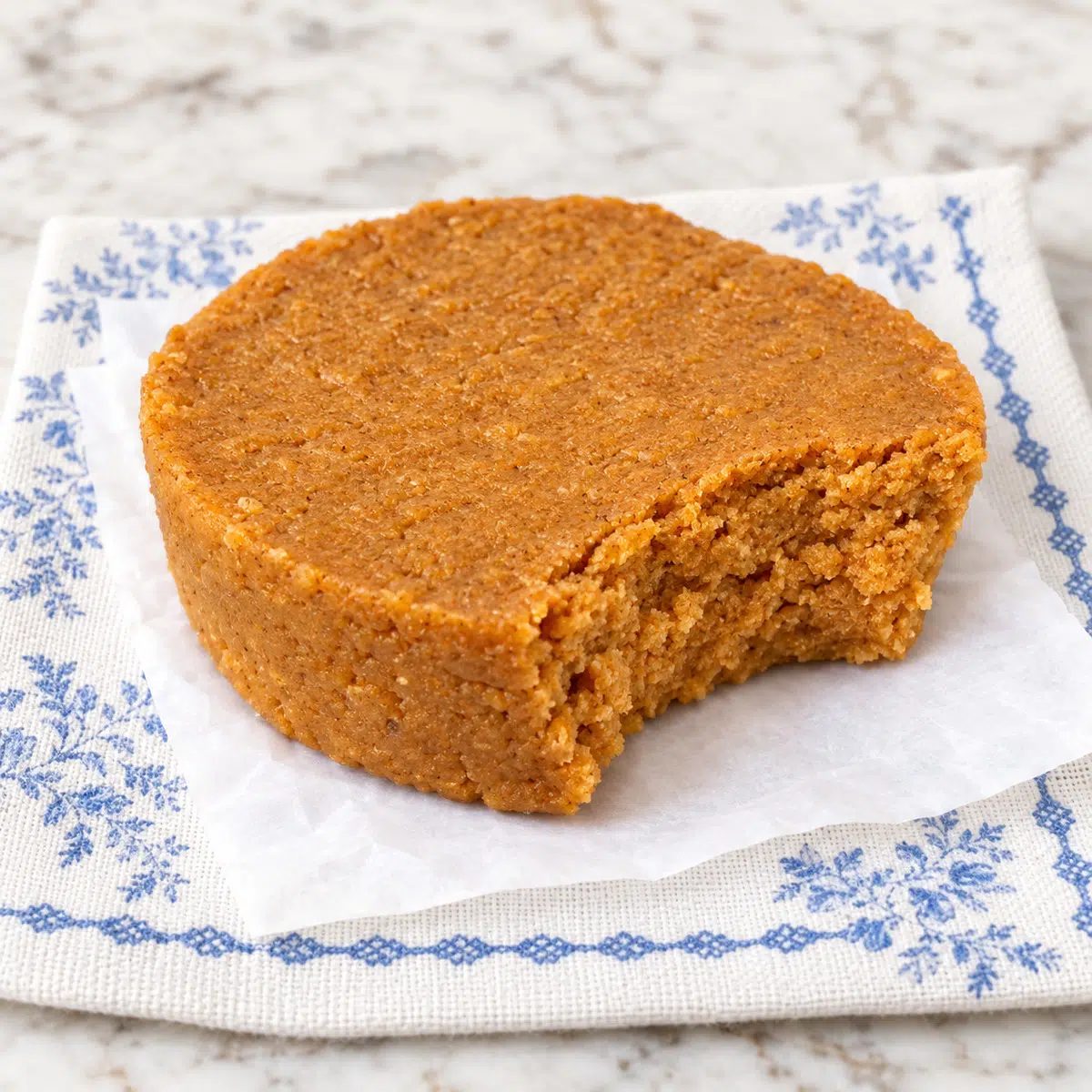 no-bake pumpkin pie protein bars with a bite taken out
