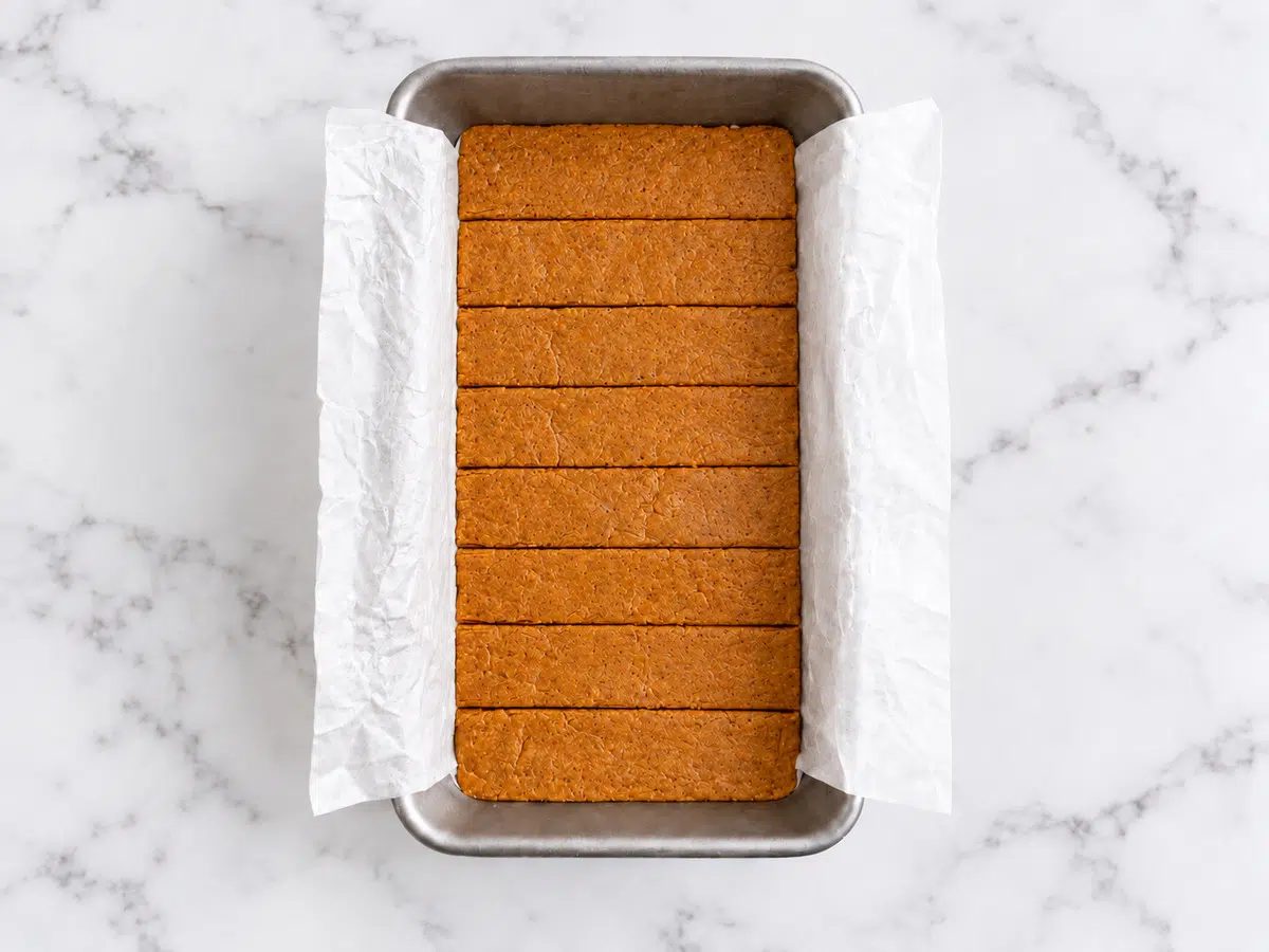 no-bake pumpkin pie protein bars in a metal loaf pan