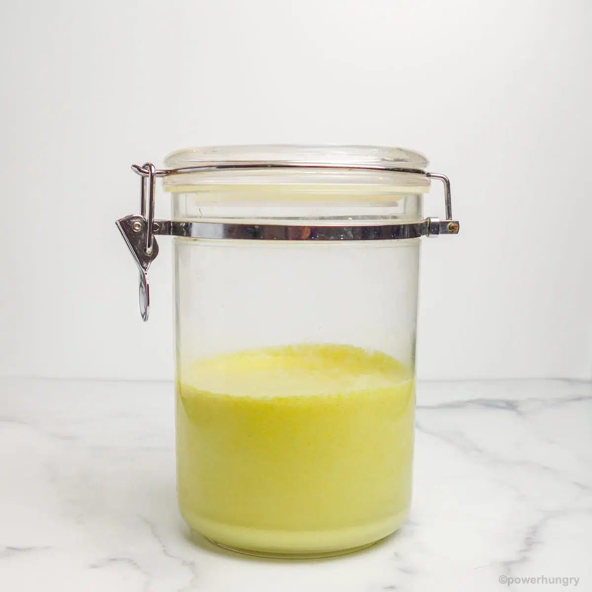 clear storage jar filled with pumpkin seed scramble batter