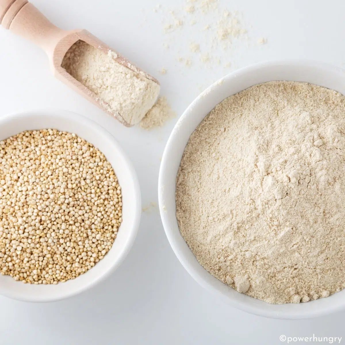 two white bowls one with quinoa and the other with quinoa flour