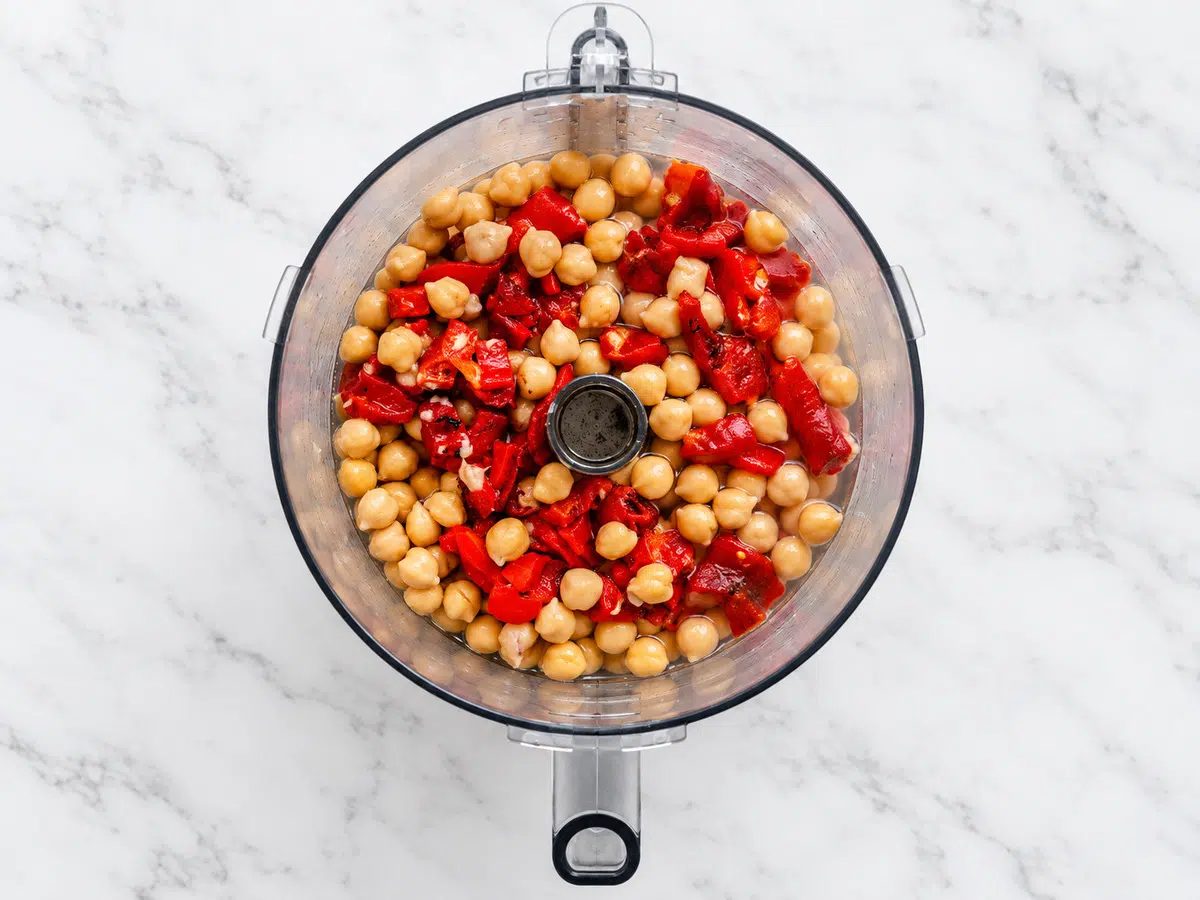 roasted red pepper hummus ingredients in a food processor bowl