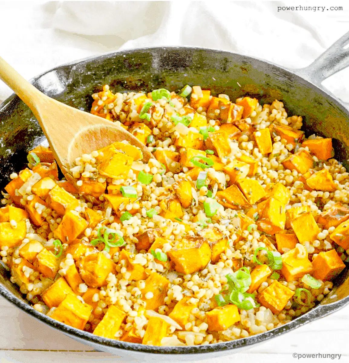 sorghum pilaf in a dark skillet