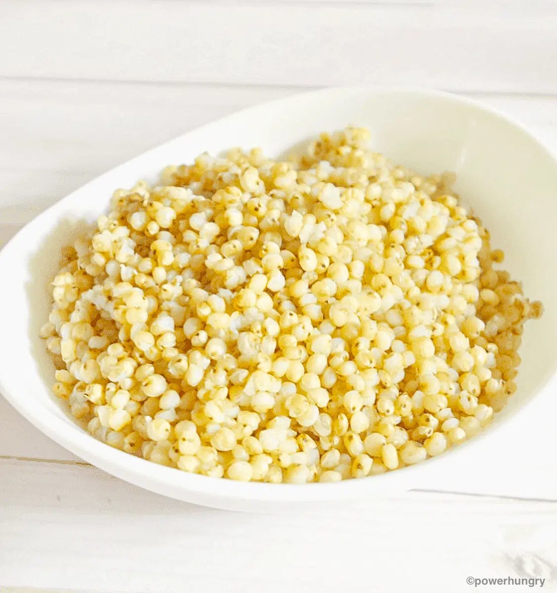 cooked sorghum in a white dish