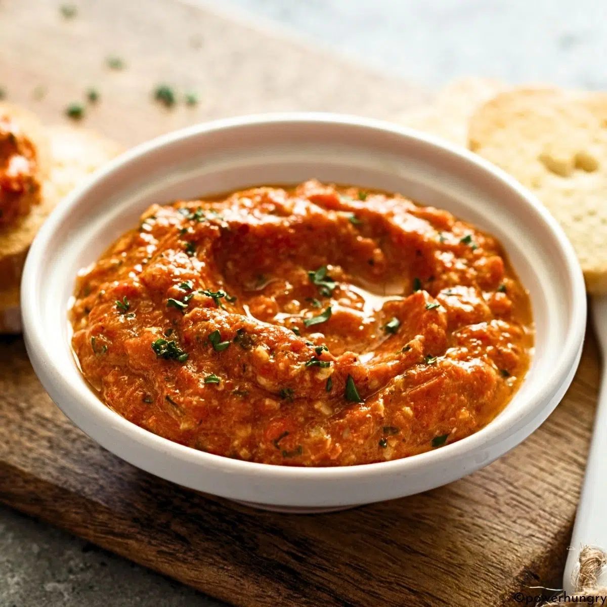 roasted red pepper spread in a white bowl