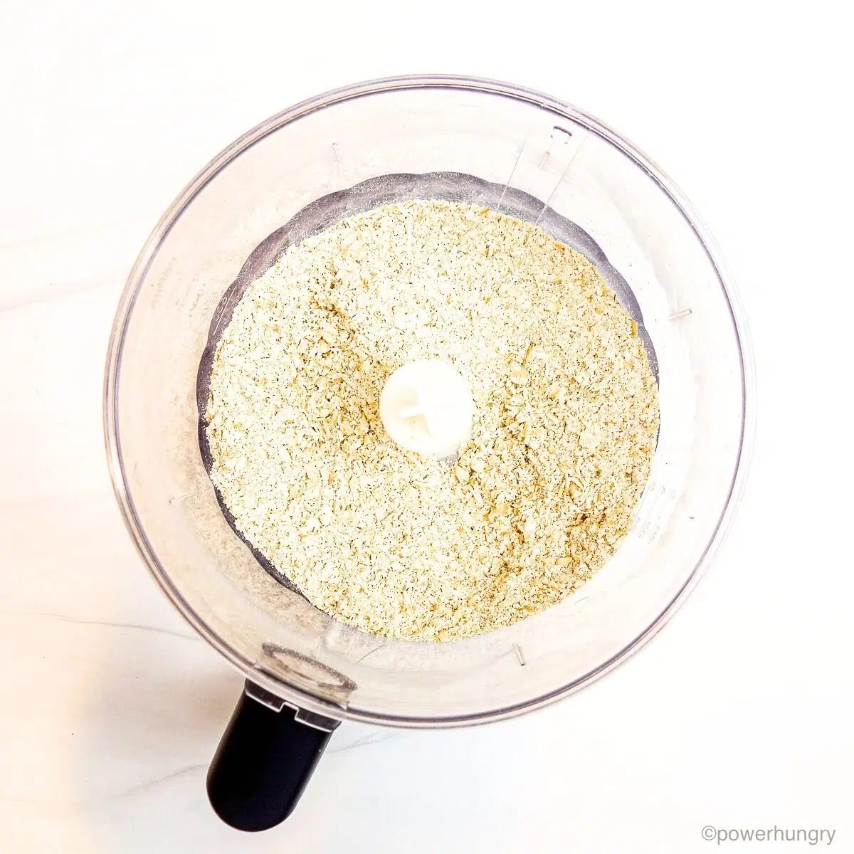 ground oats in a food processor bowl
