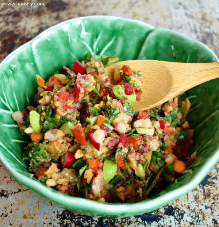green bowl filled with the pickled filling for sesame sriracha cucumber cups