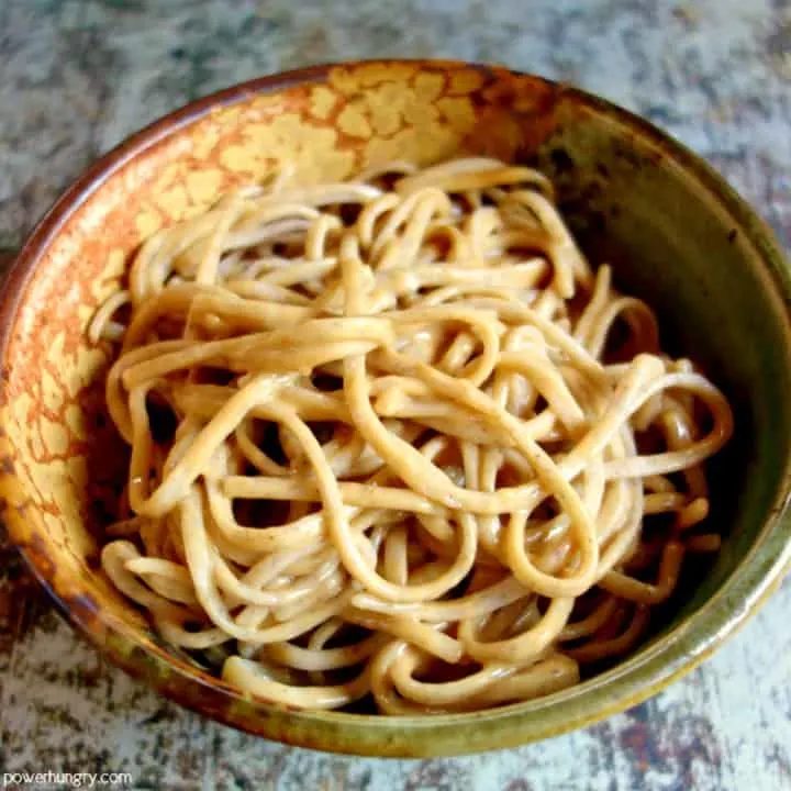 small bowl of buckwheat soba noodles with tahini sauce
