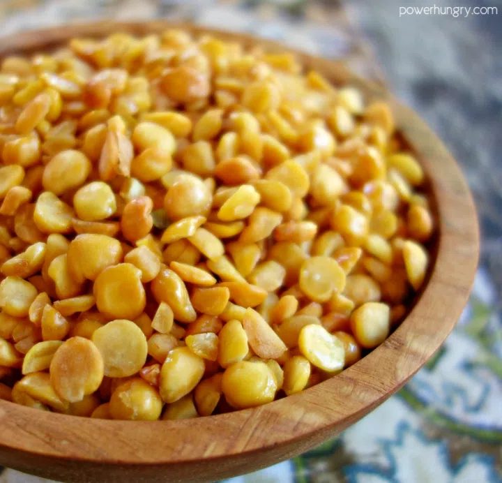 close-up of crispy baked split peas in a wooden bowl