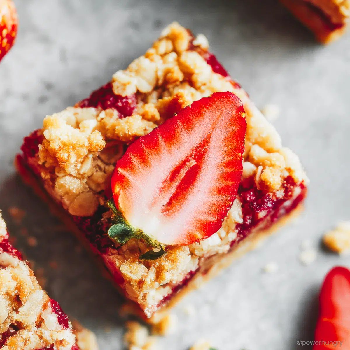 strawberry oatmeal bar with sliced strawberry on top