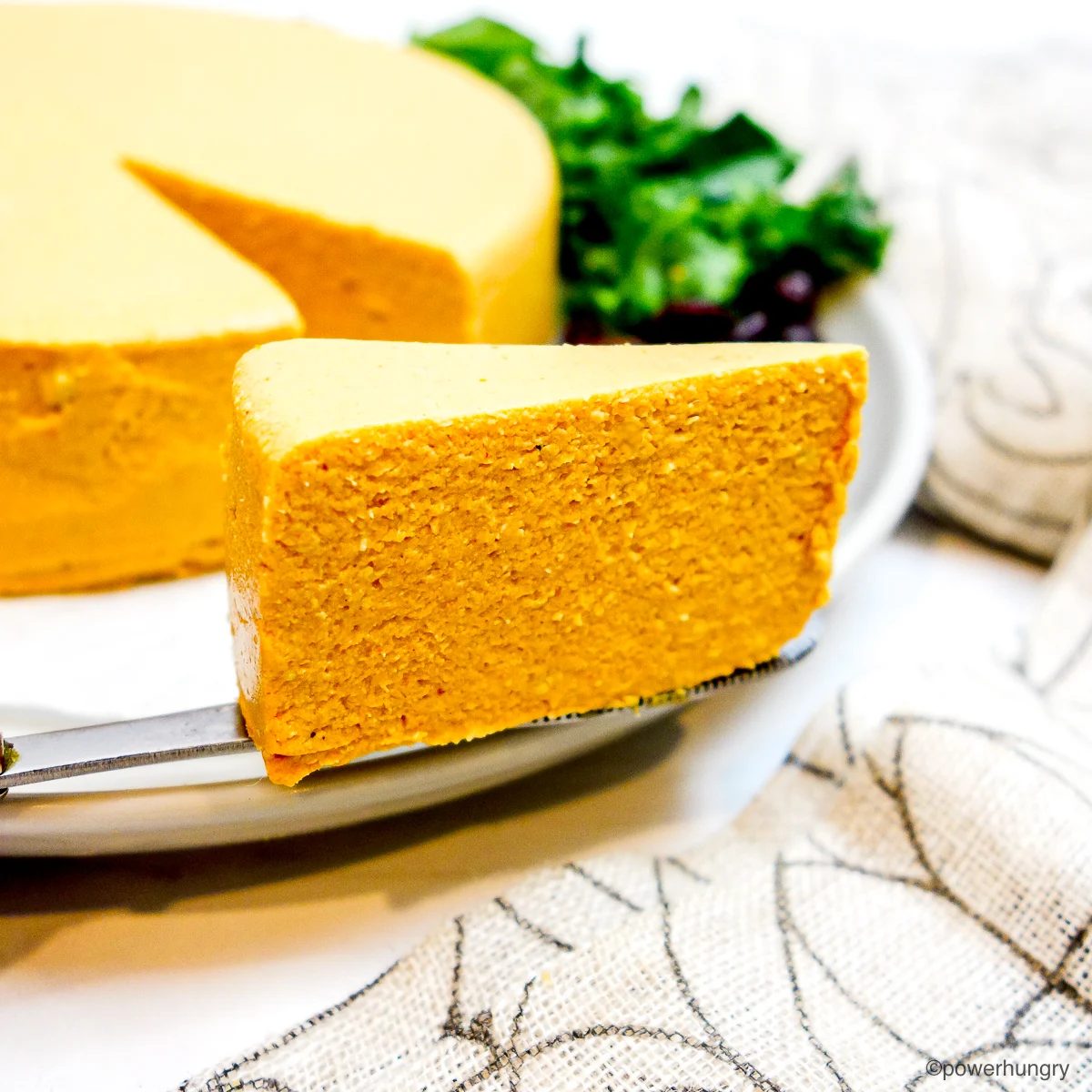 wedge of vegan cheddar cheese