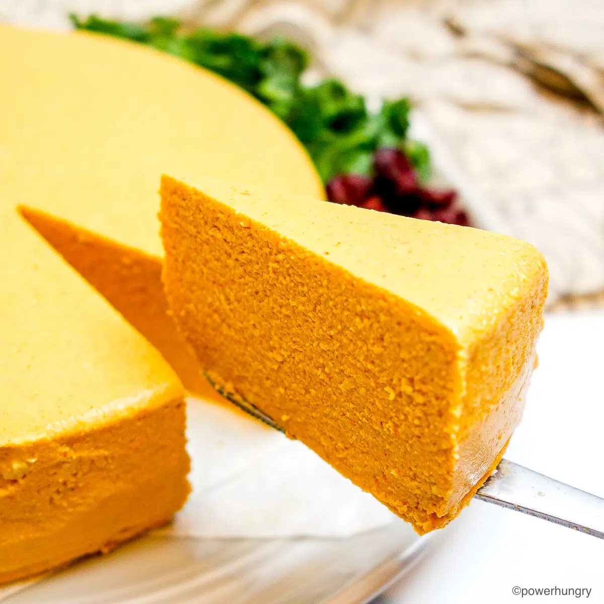 a wedge of vegan cheddar cheese on plate