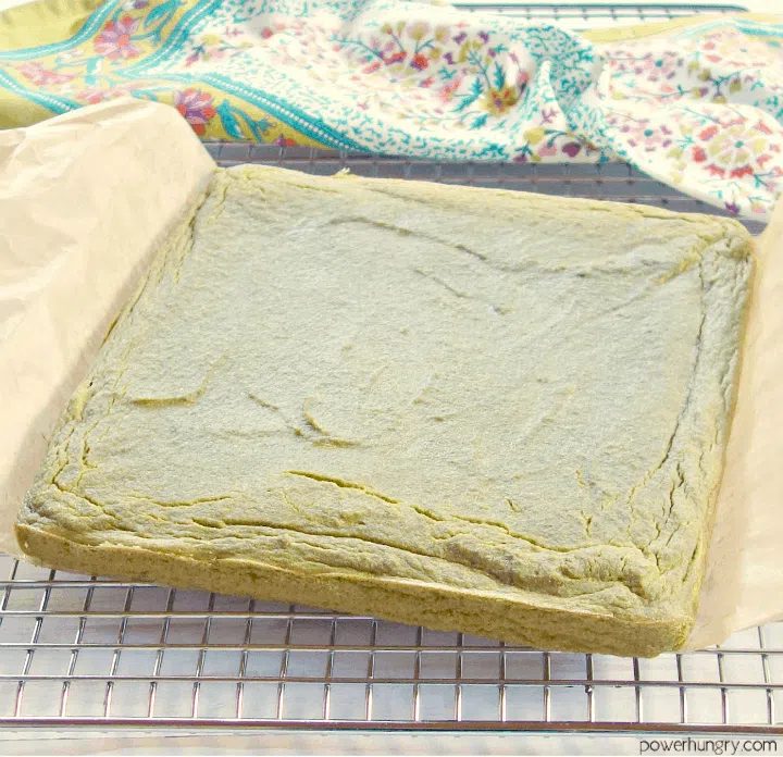 freshly baked fresh herb lentil bread on a cooling rack, uncut