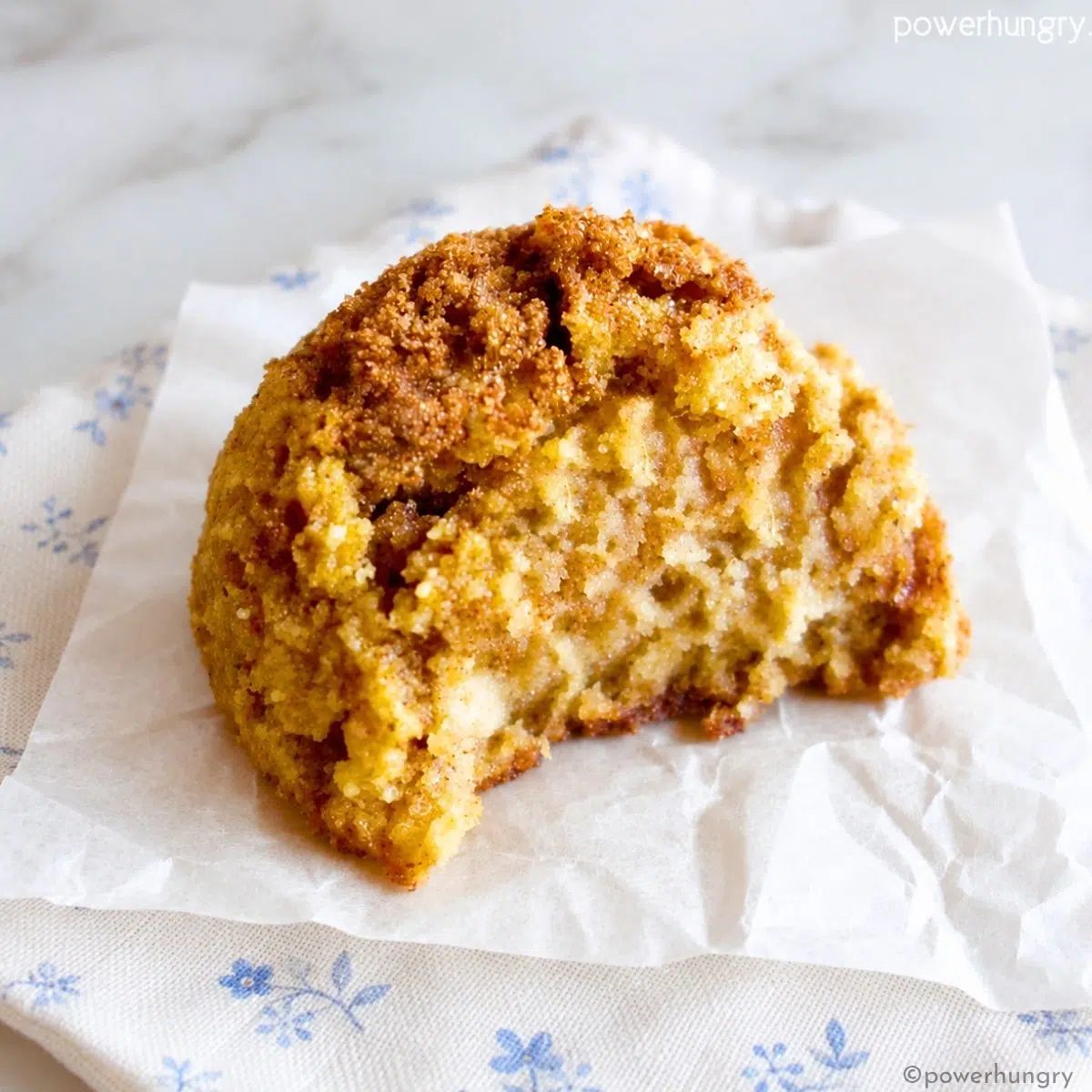 a single almond flour sweet potato cookie with a bite taken out of it, showing the interior