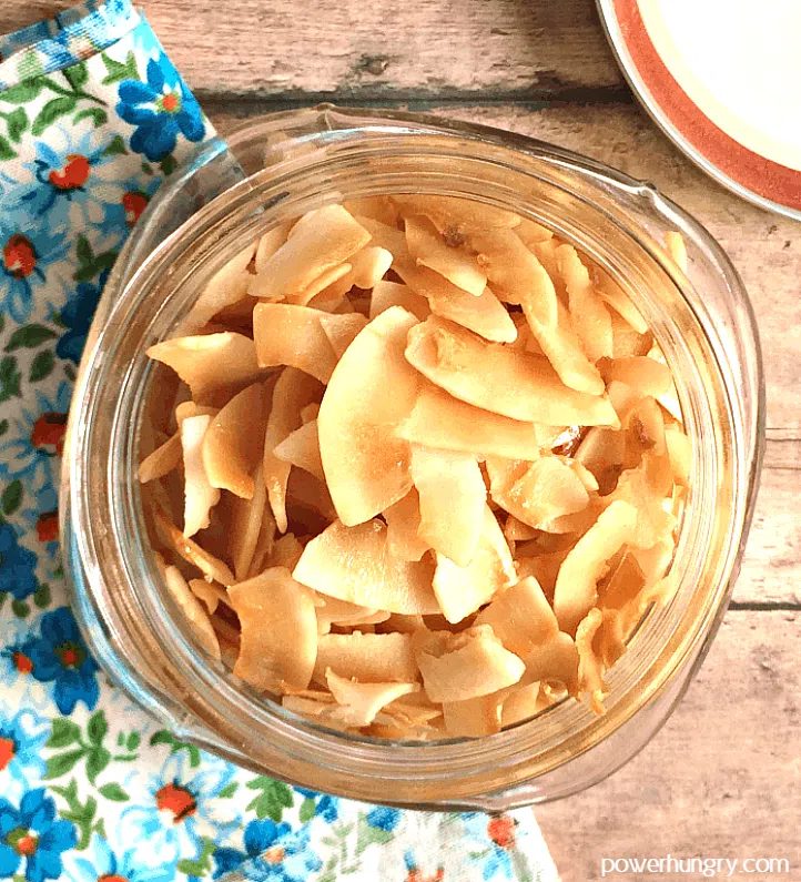 baked sweet salty coconut chips in a glass jar