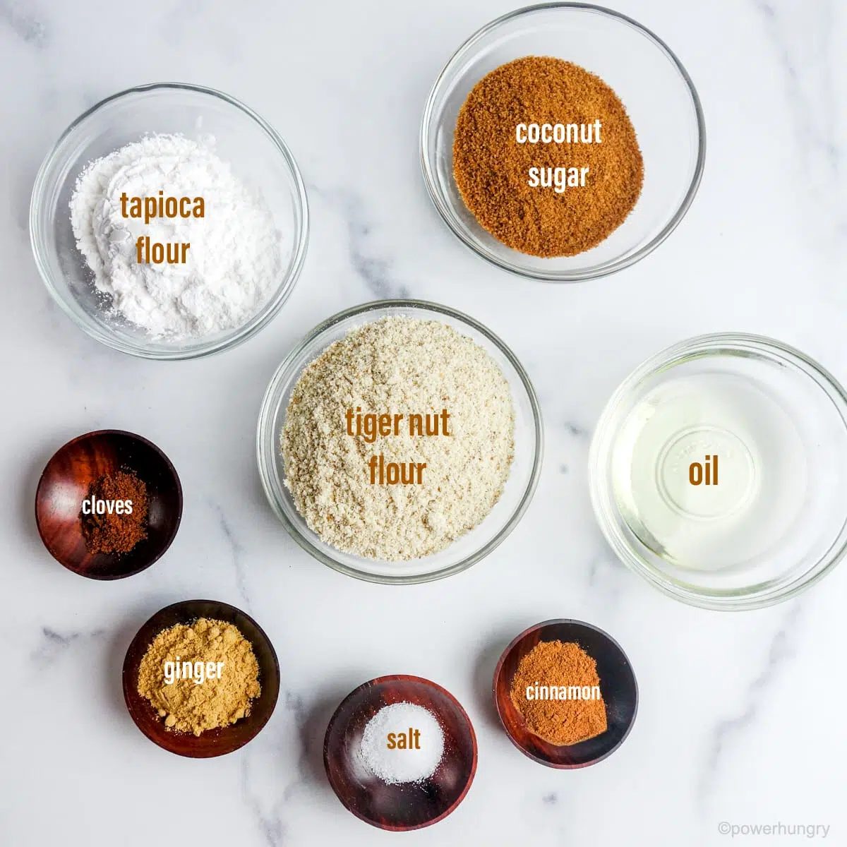ingredients for tiger nut flour cookies, all in small glass or wood bowls