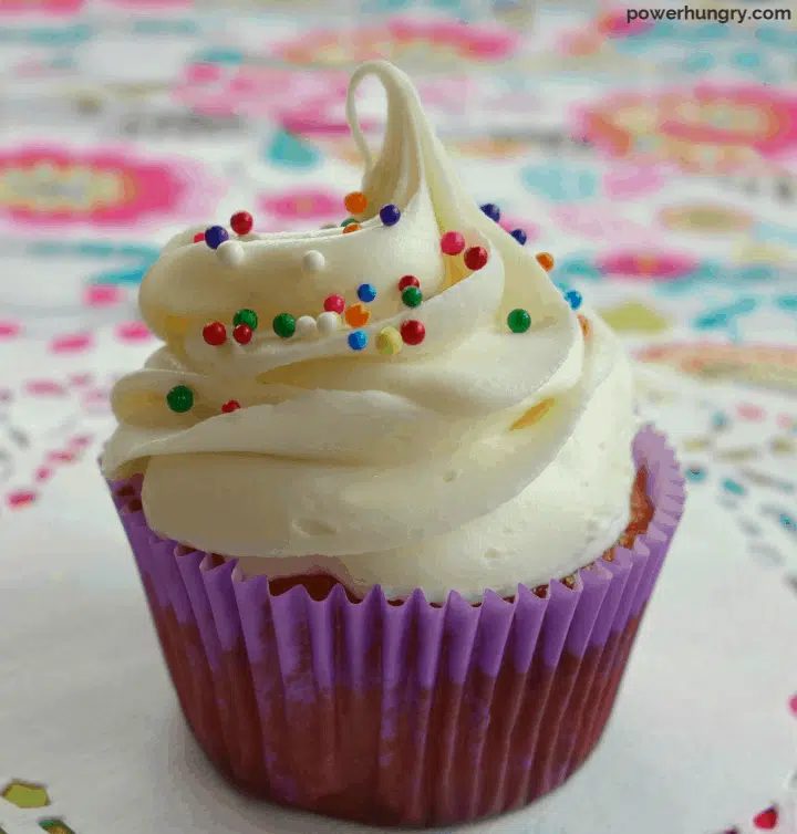 close up of cupcake frosted with vegan vanilla buttercream frosting