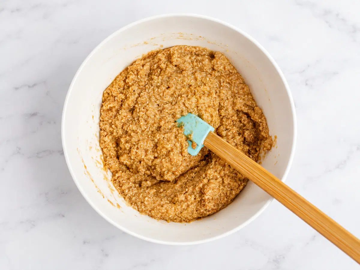 two almond flour applesauce bars dough in a bowl