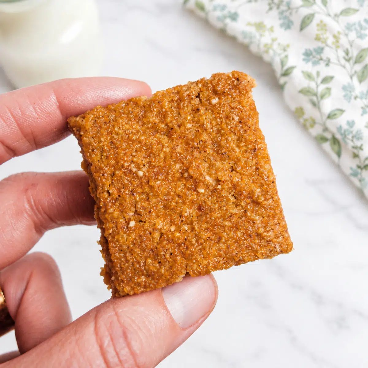 a single almond flour applesauce bar, held in a hand