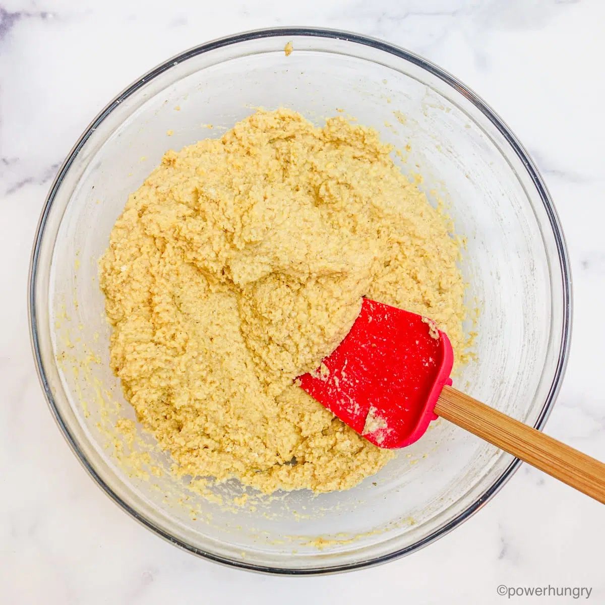 vegan almond flour bread dough in a glass bowl