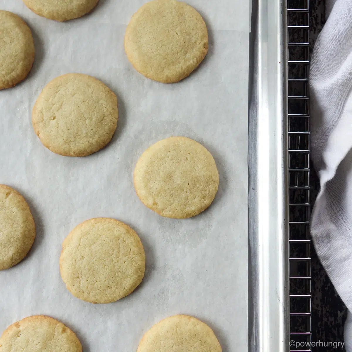 almond flour cut out cookies, baked, on a baking sheet