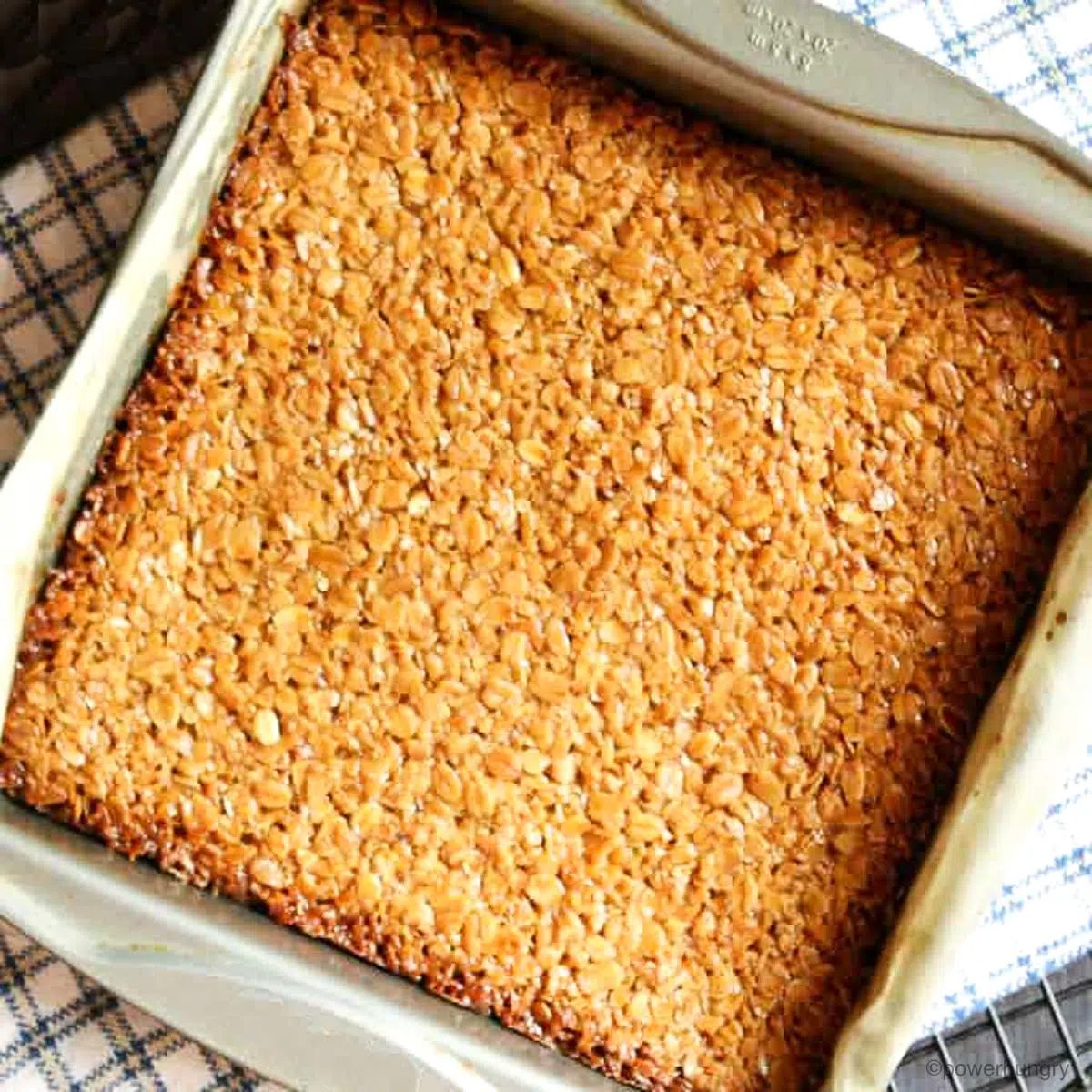 uncut oat flapjacks in a metal tray