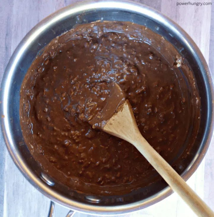 saucepan with cooked rolled oats with cocoa powder added