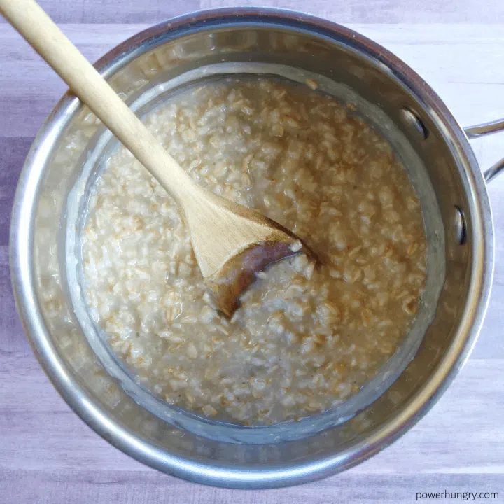 overhead shot of rolled oat being cooked in a saucepan