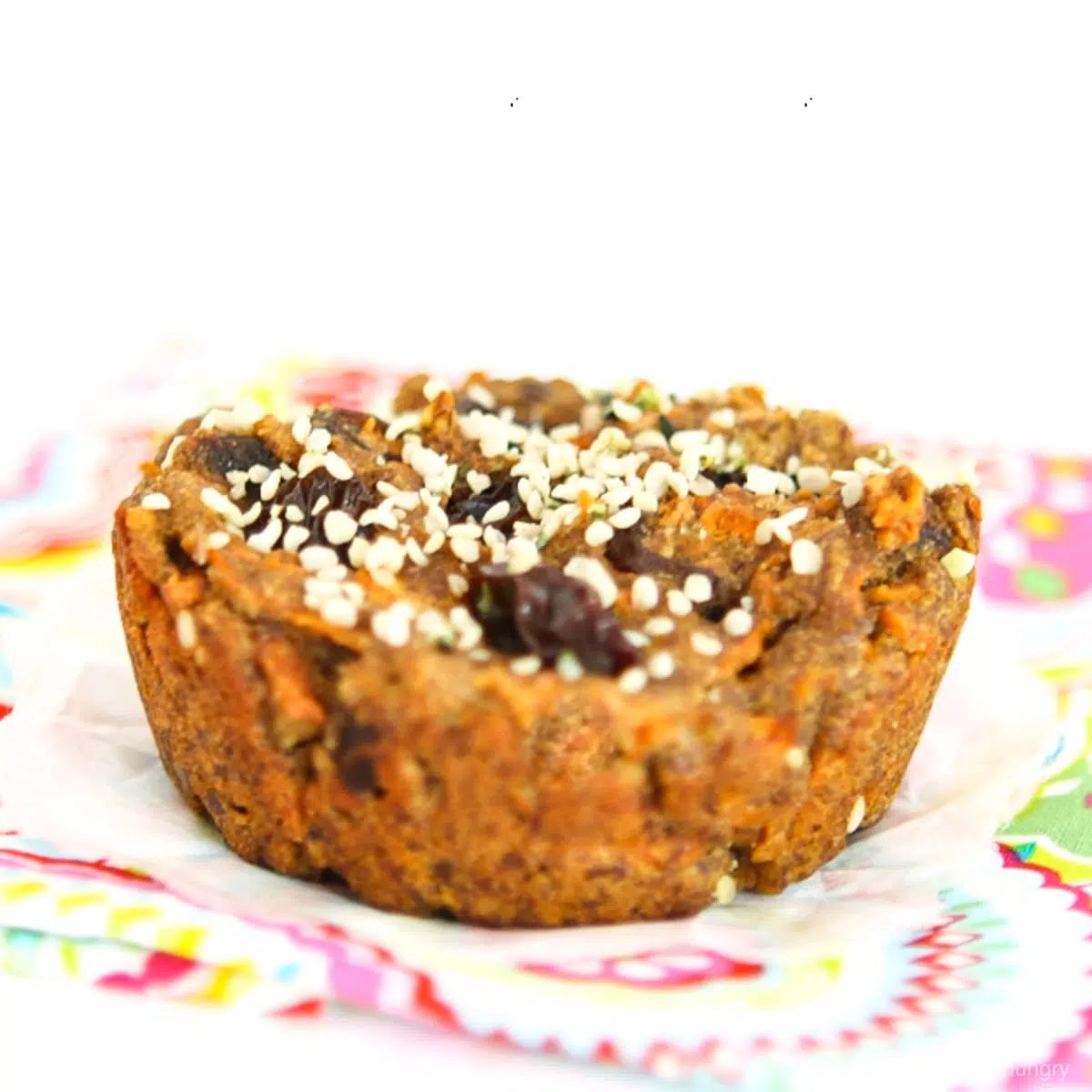 a carrot cake breakfast cookie on a colorful napkin