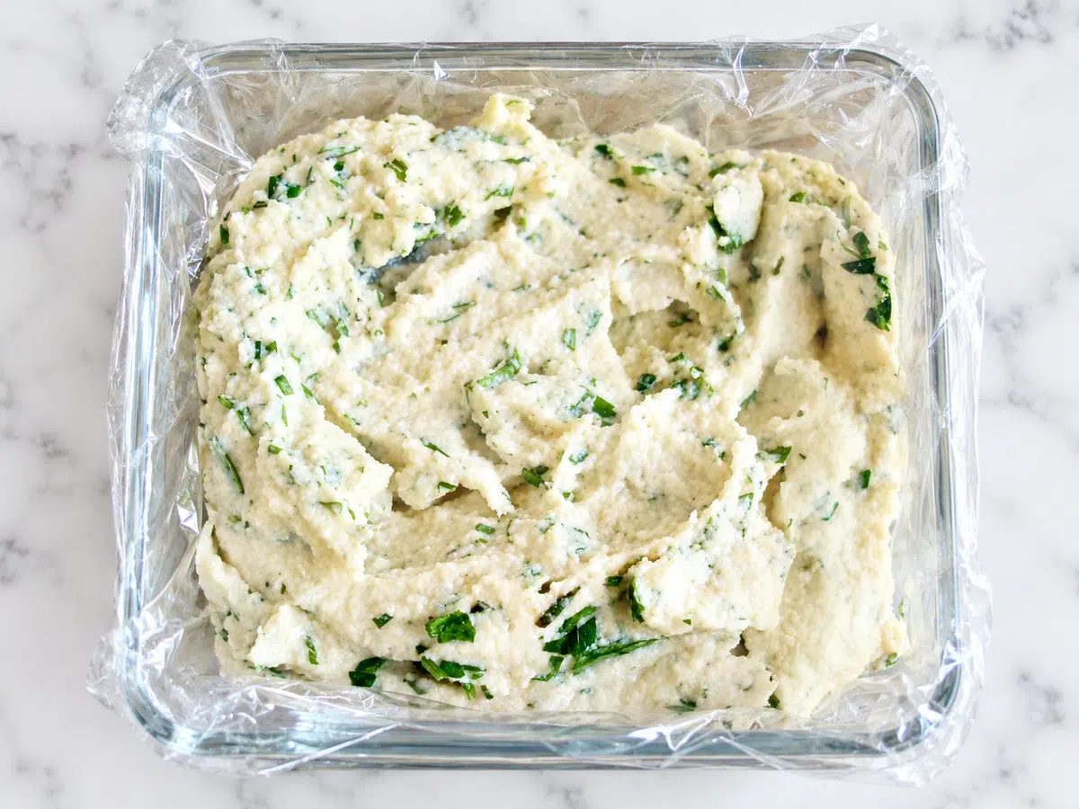 shaping the cheese in a mold for vegan Boursin