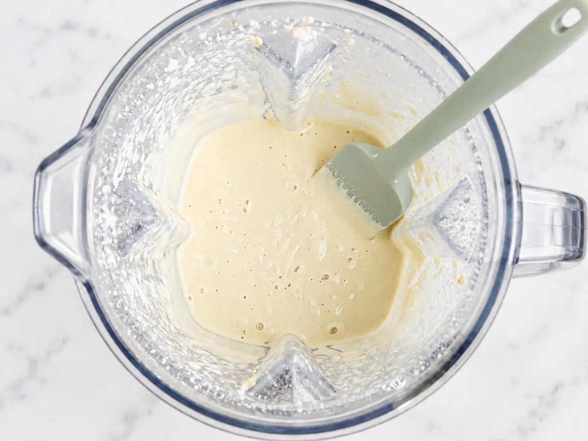 tasting for consistency of blended cashew mixture for vegan Boursin