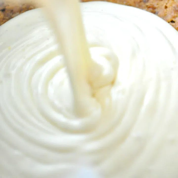 vegan cshew cheesecake filling being poured into a no-bake crust