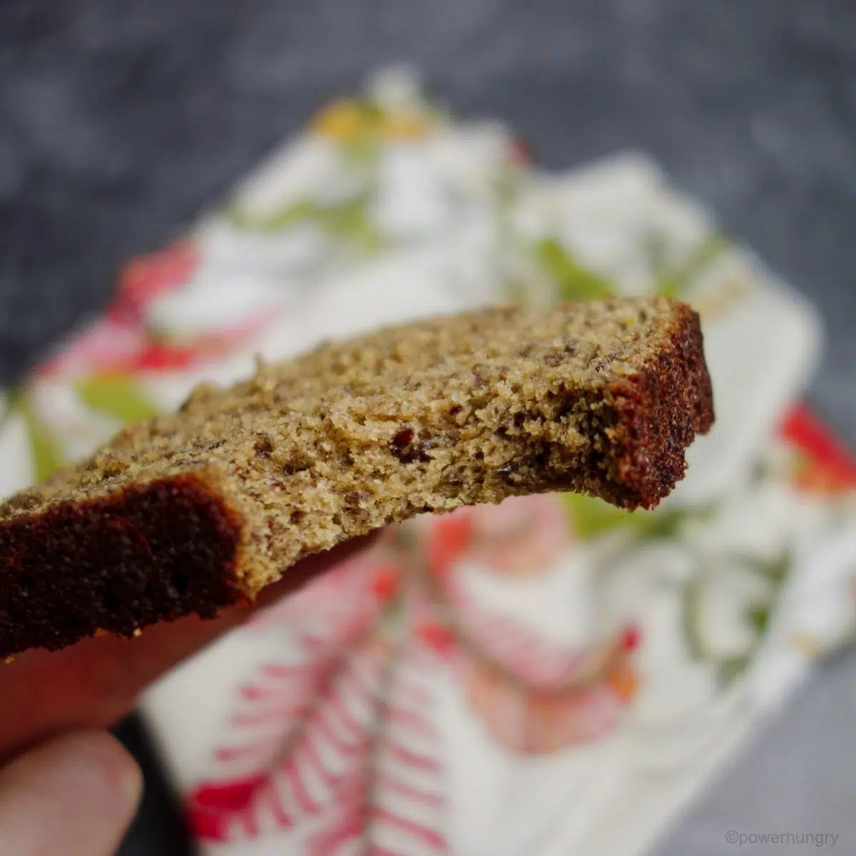 close up of a slice of banana bread with a bite taken out