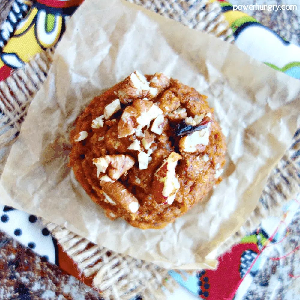a vegan pumpkin chickpea flour cookie on a piece of parchment