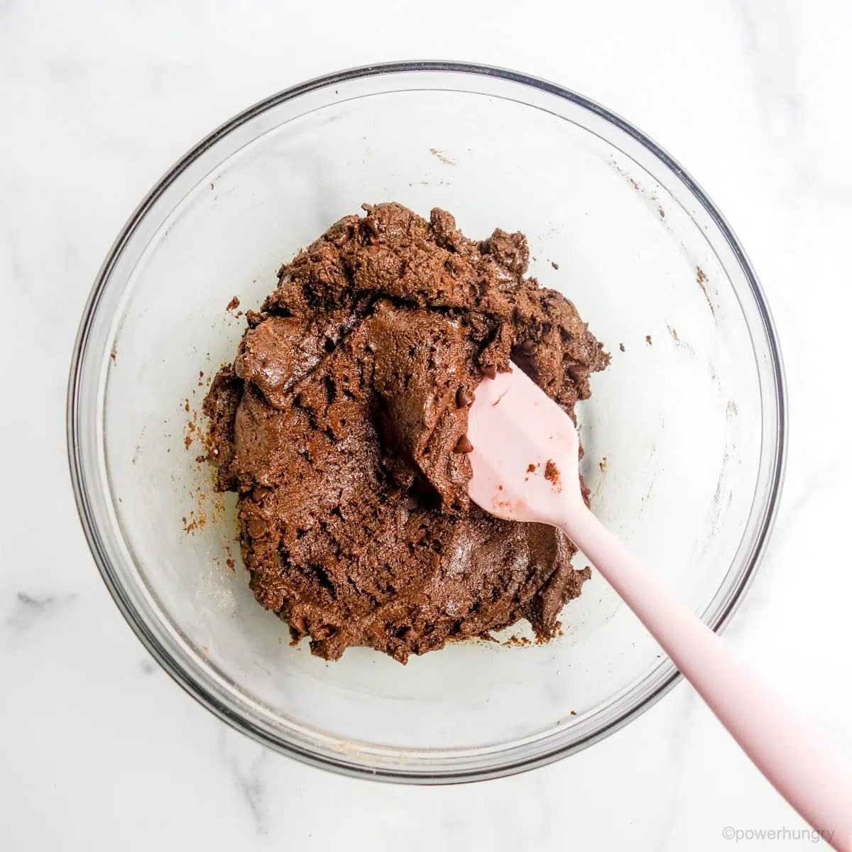 Glass bowl filled with buckwheat chocolate cookie dough