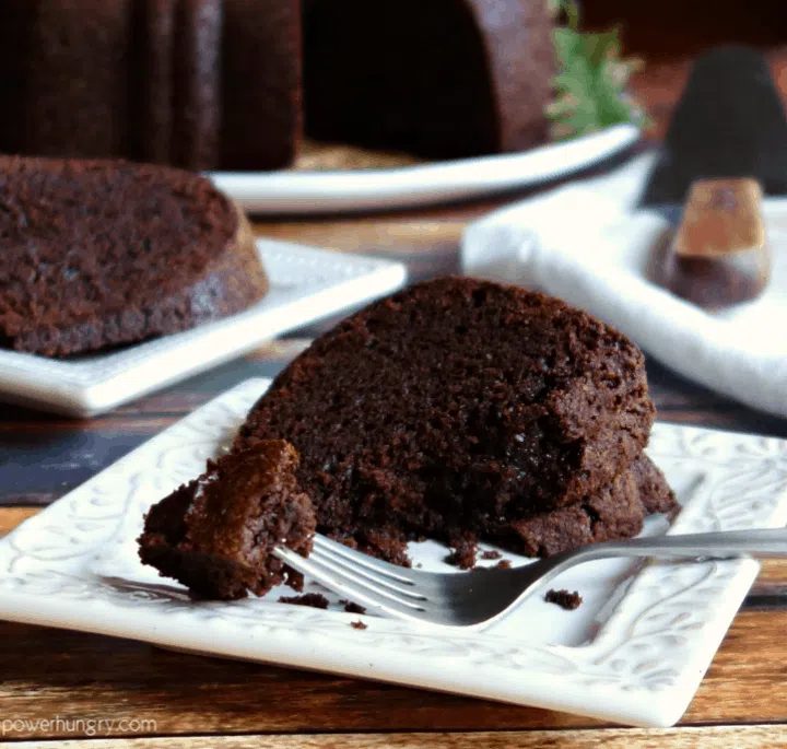 slice of vegan chocolate Bundt cake on a white square plate