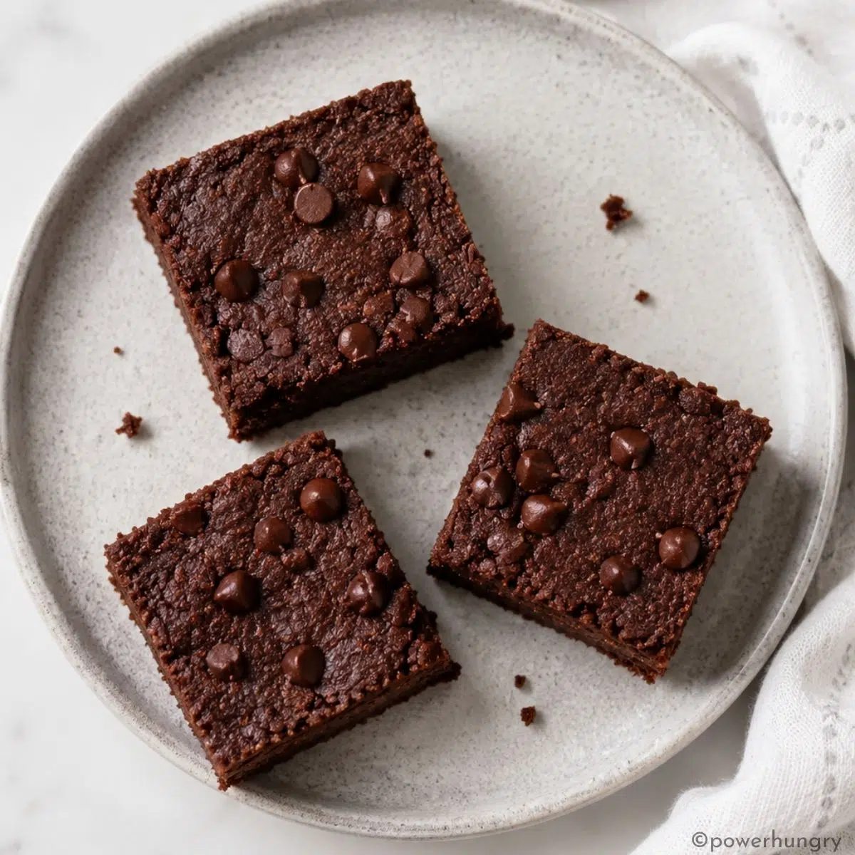 overhead shot of a plate of vegan coconut flour brownies
