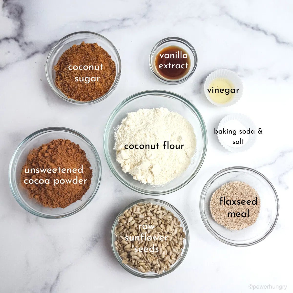 ingredients, in small glass bowls, for coconut flour chocolate cupcakes