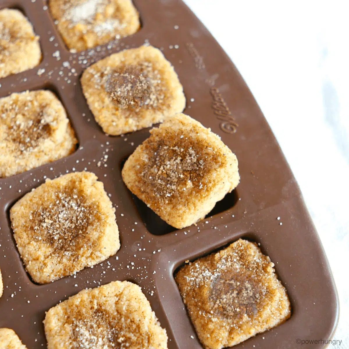 mini donut bites in a square mini muffin pan