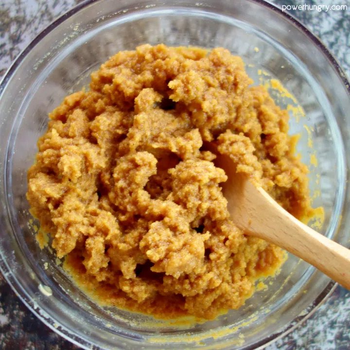 Dough for pumpkin coconut flour cookies in a glass mixing bowl.