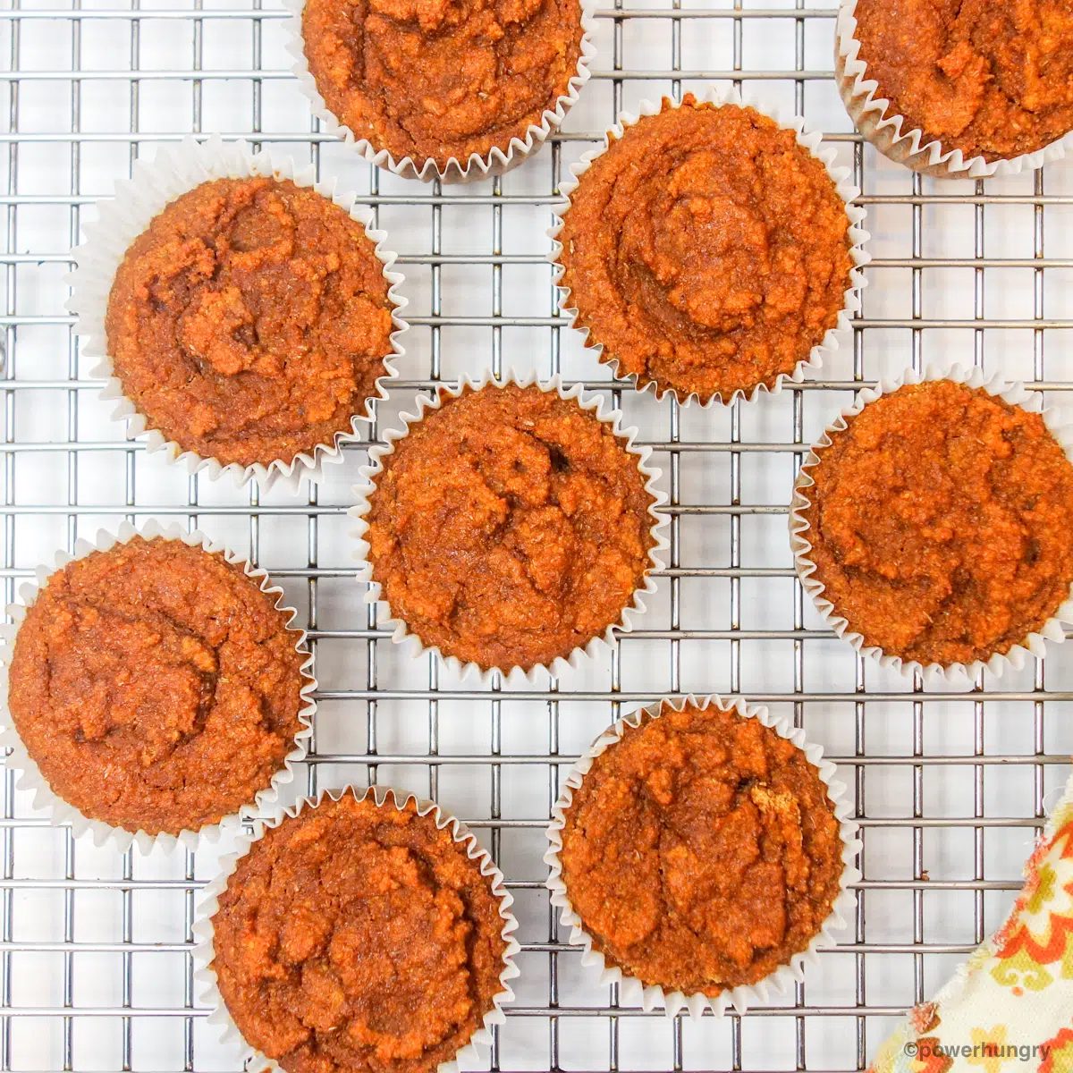 vegan coconut flour pumpkin muffins on a cooling rack
