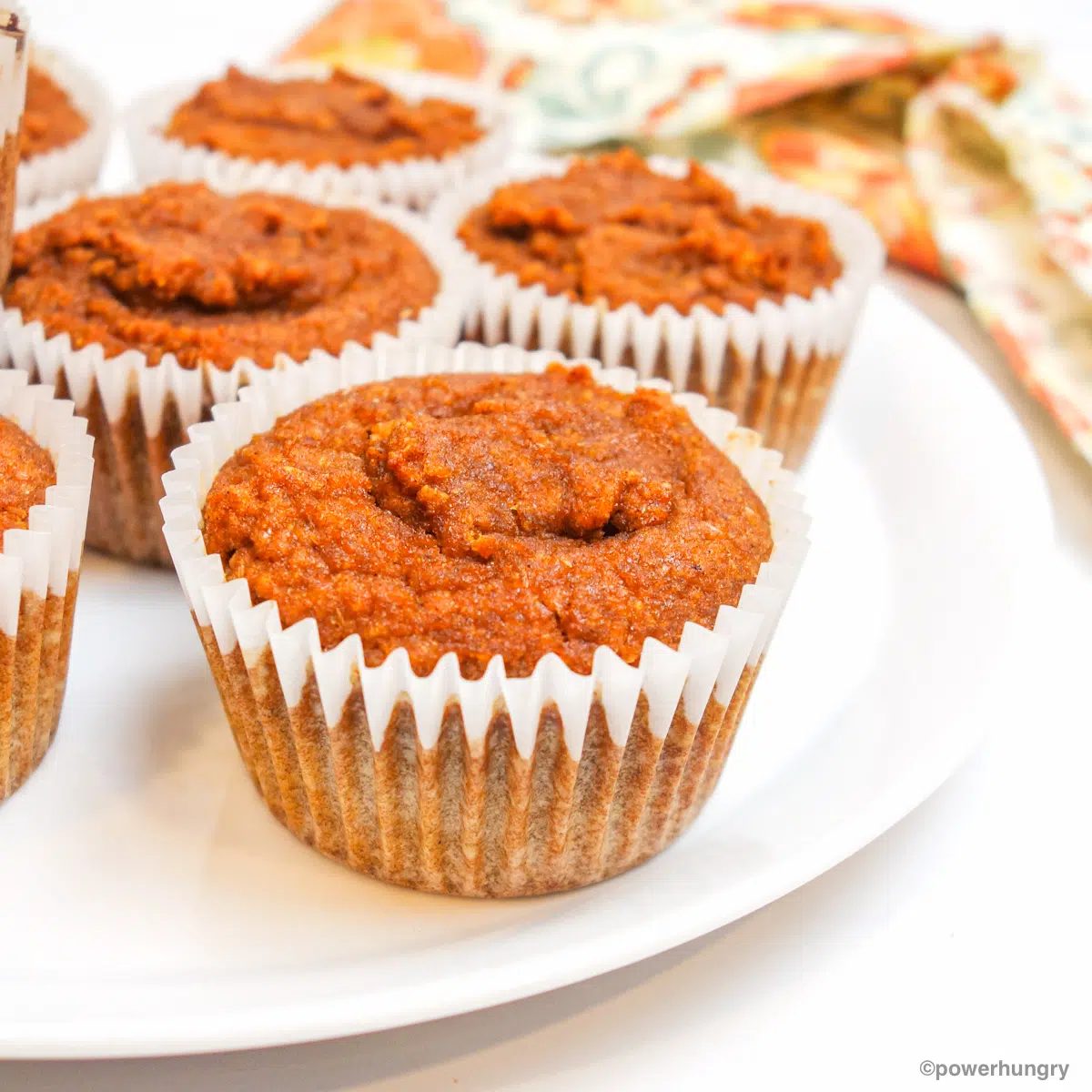 vegan coconut flour pumpkin muffins on a white plate