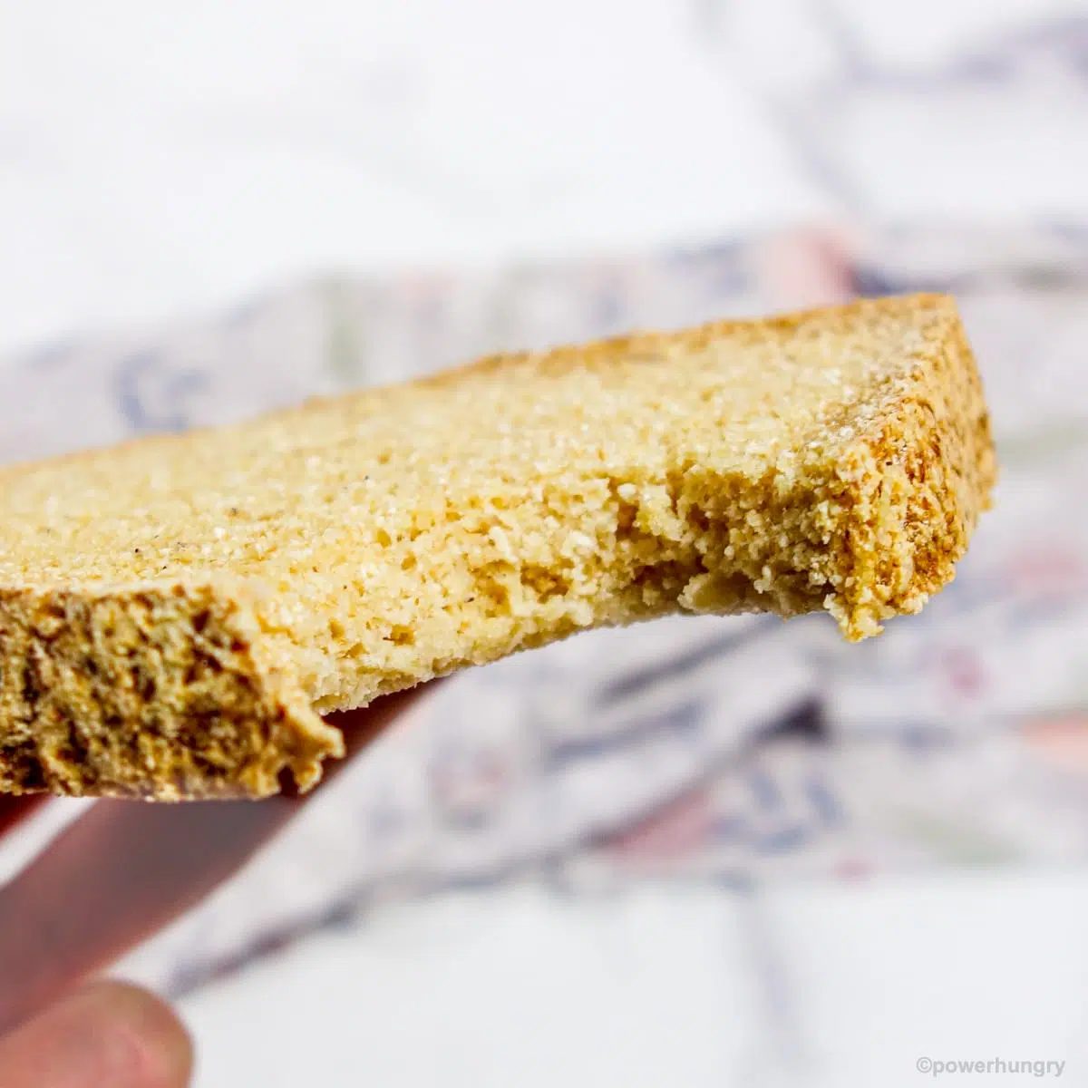 slice of coconut flour bread with a bite taken out of it