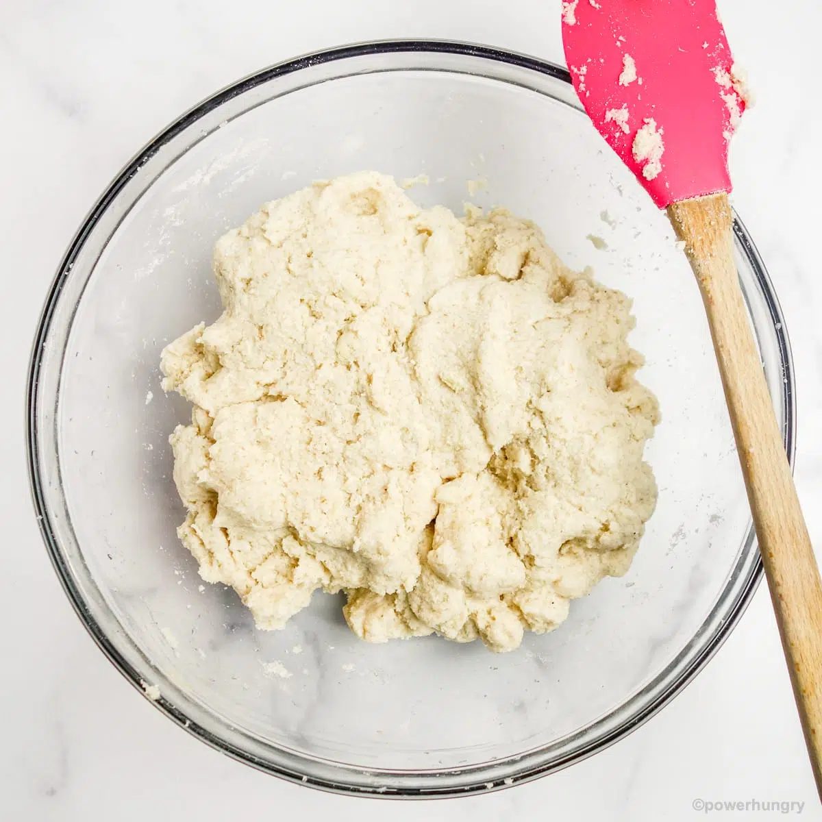 count flour sandwich bread dough in a glass mixing bowl