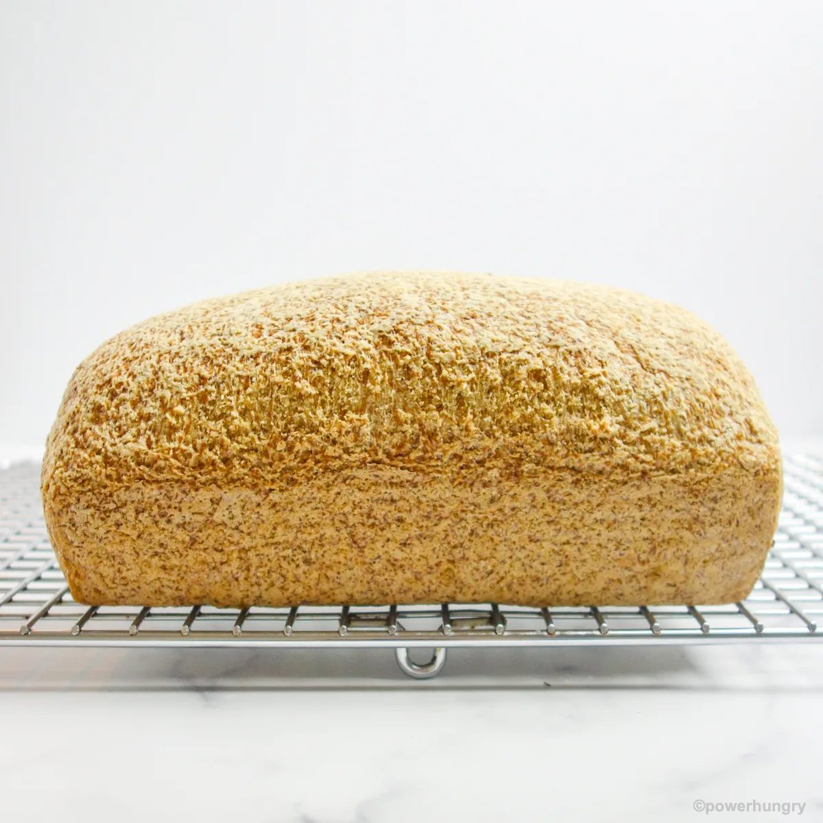 vegan coconut flour bread cooling on a metal cooling rack