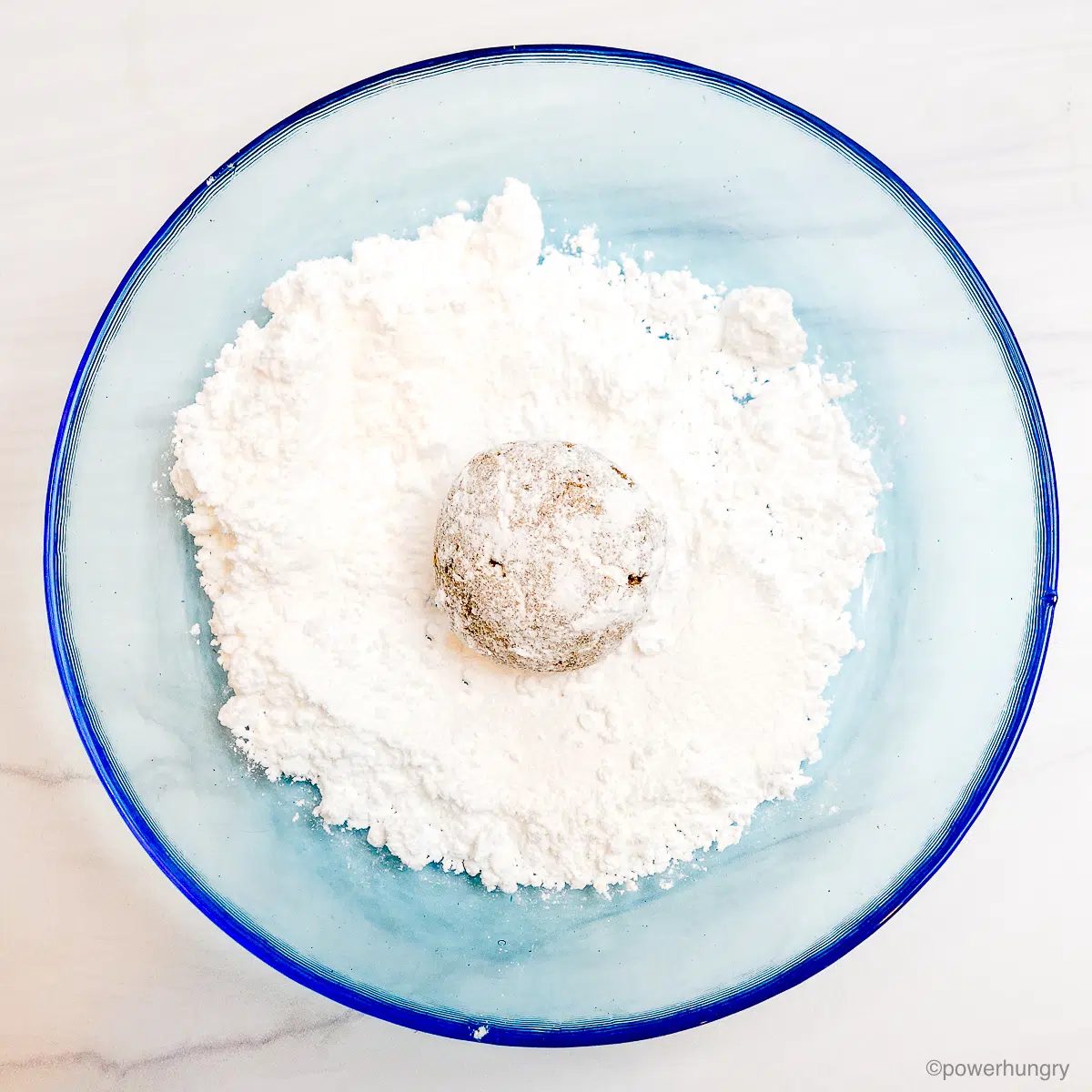 coconut cookie in powdered sugar