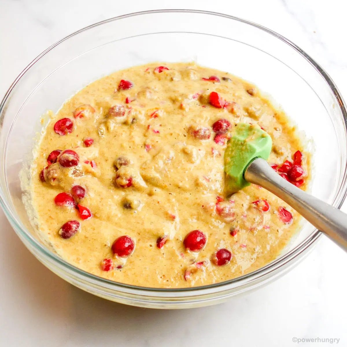glass bowl filled with the batter for vegan cranberry orange chickpea flour bread