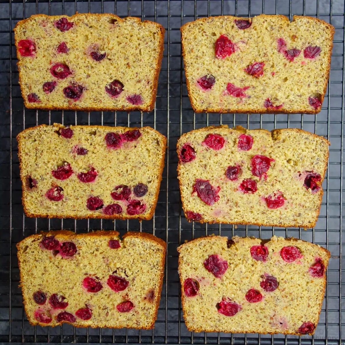 six slices of sweet bread on a black cooling rack