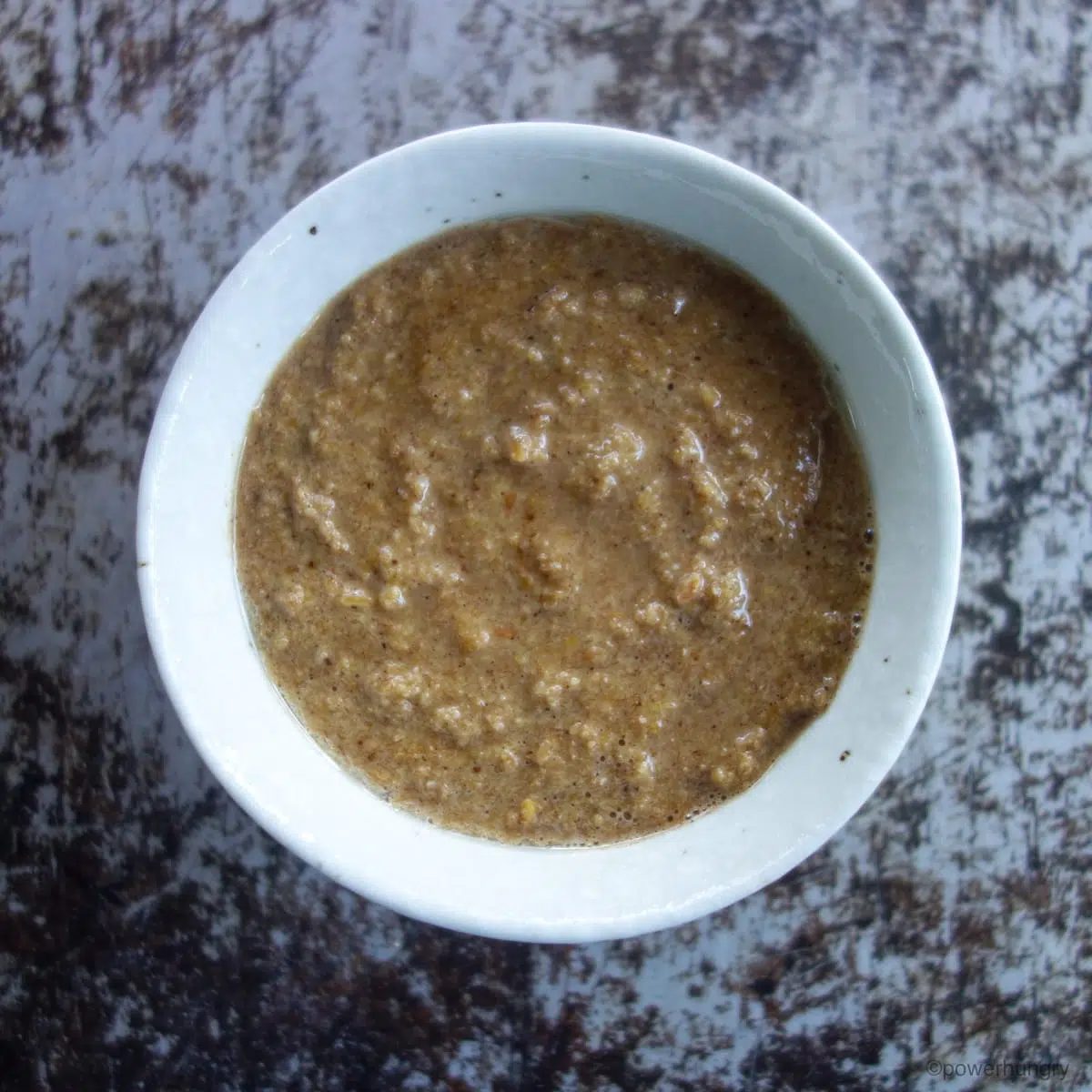 flaxseed muffin batter in white bowl