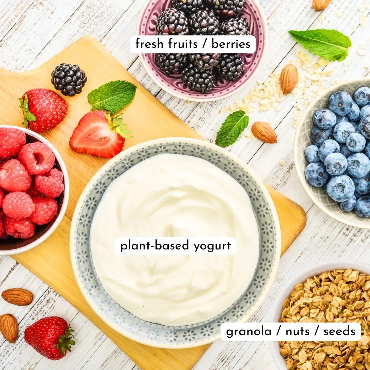 ingredients for vegan frozen yogurt bark, all in separate bowls
